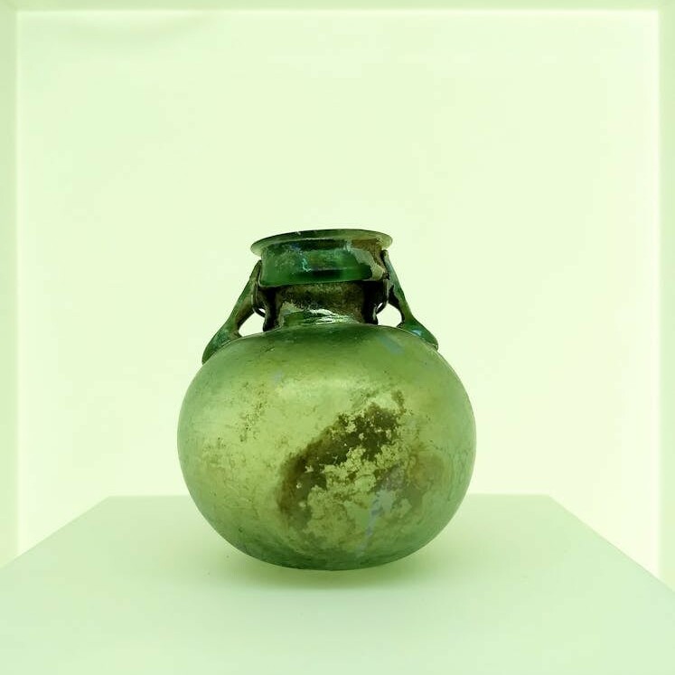 Green Glass Vase on White Surface